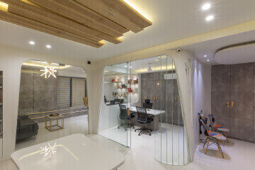 Executive commercial office reception area design by Vinay Interiors